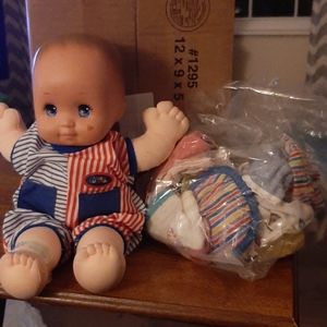 Magic nursery doll and clothes
